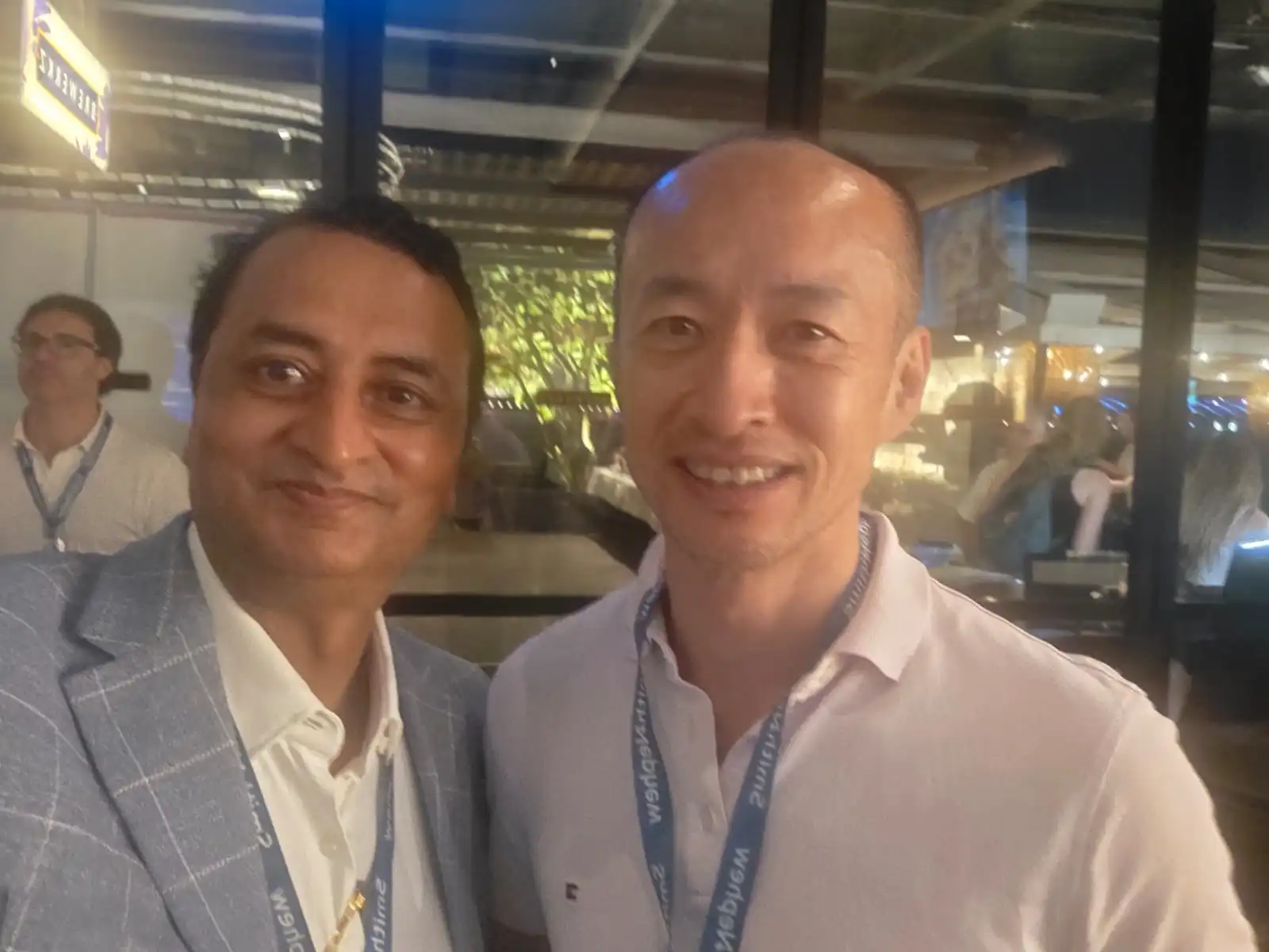 Dr. Pradeep Moonot with a fellow surgeon at a Smith+Nephew event